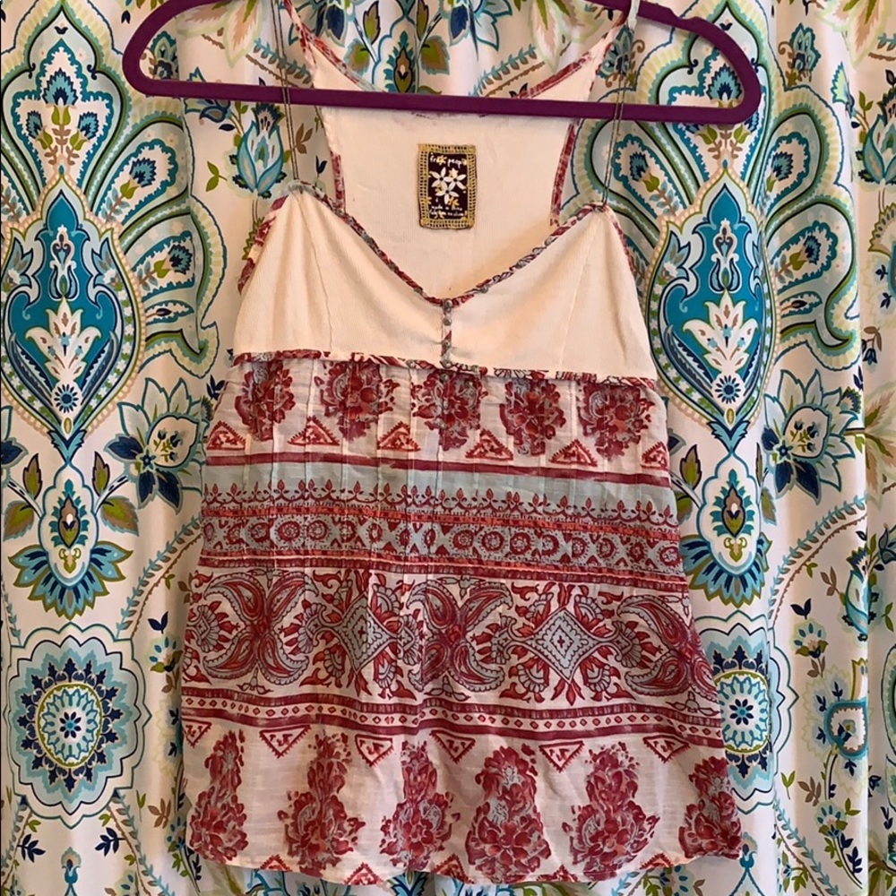 Reds and blues on white tank top